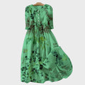 Grünes Kleid mit Schattierten Blumen